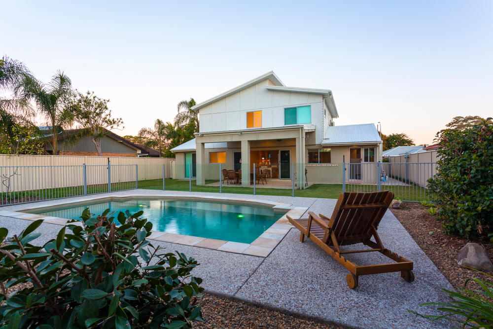 image of a backyard with Glass Pool Fencing around the pool